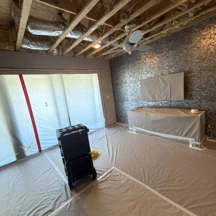 Drying equipment set up in a water-damaged Caldwell County home