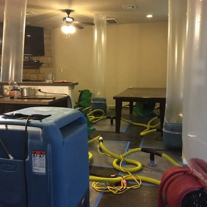 Truck-mounted water extraction gear on a job site