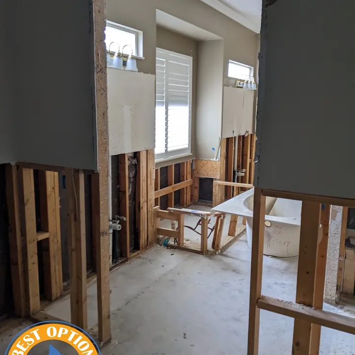 Flood-cut drywall and drying in progress after standing water